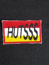 Hutsss-embleem-in-Oeteldonk-kleuren